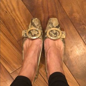 Prada kitten heels with wood buckle.